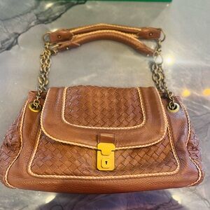 Bottega Veneta brown and tan veneta napoli flap bag.